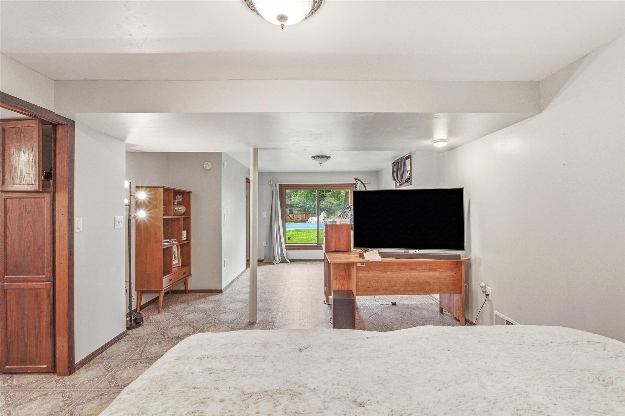 The lower level offers endless flexibility for recreation, hobbies, or extended living space.