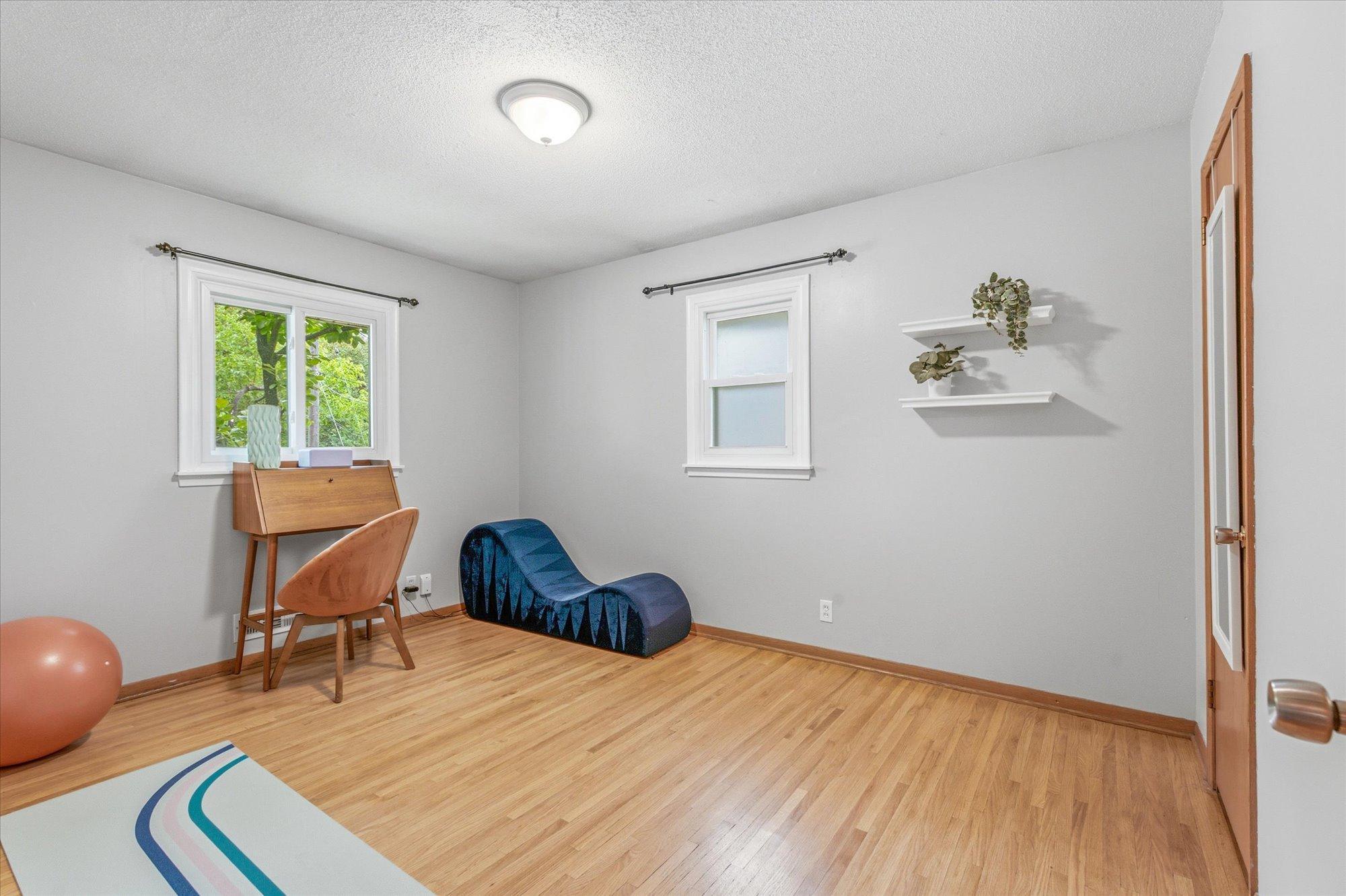 A generously sized secondary bedroom provides plenty of room with tasteful neutral colors.