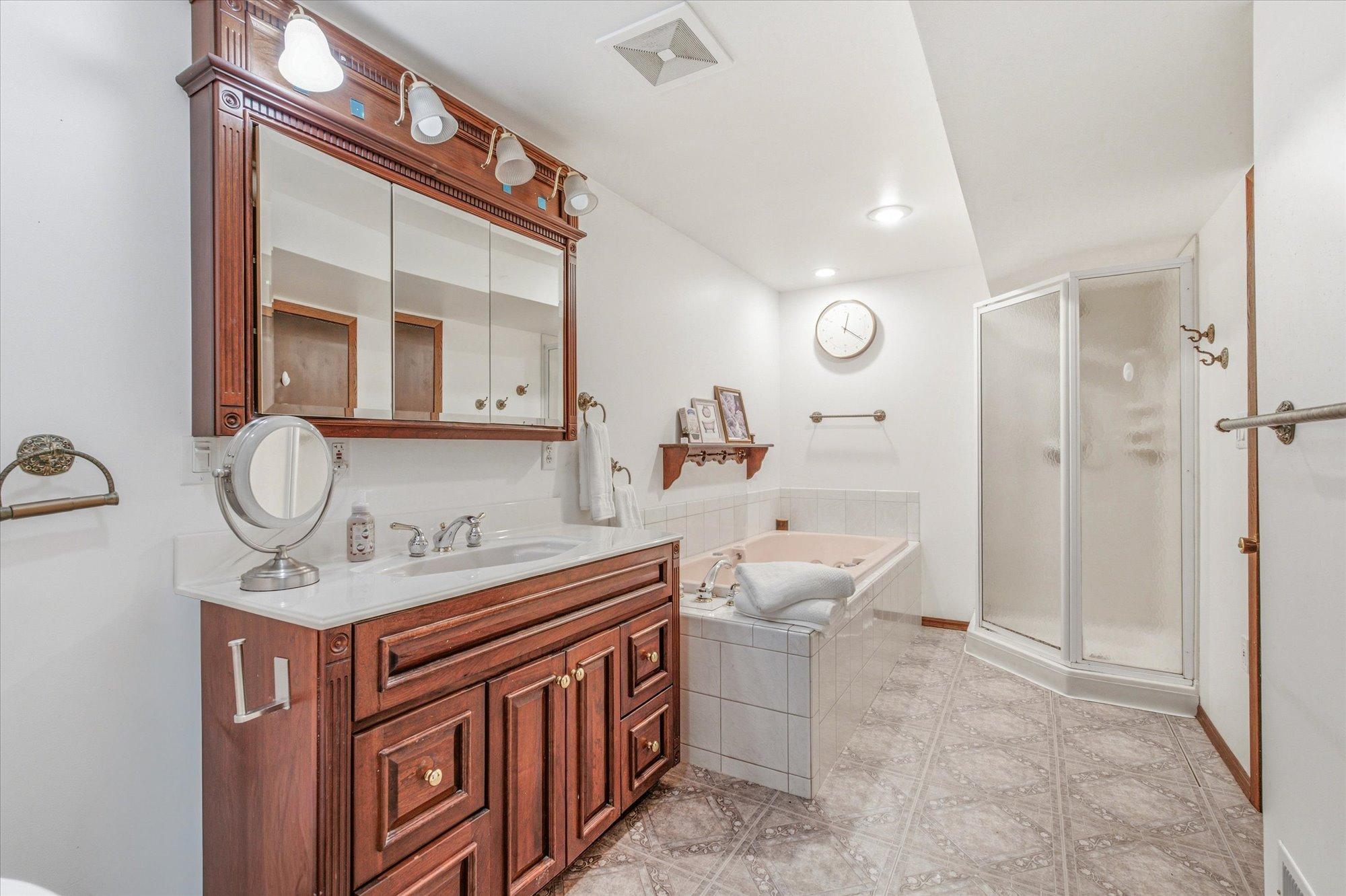 The oversized bathroom offers a large vanity with exceptional storage.
