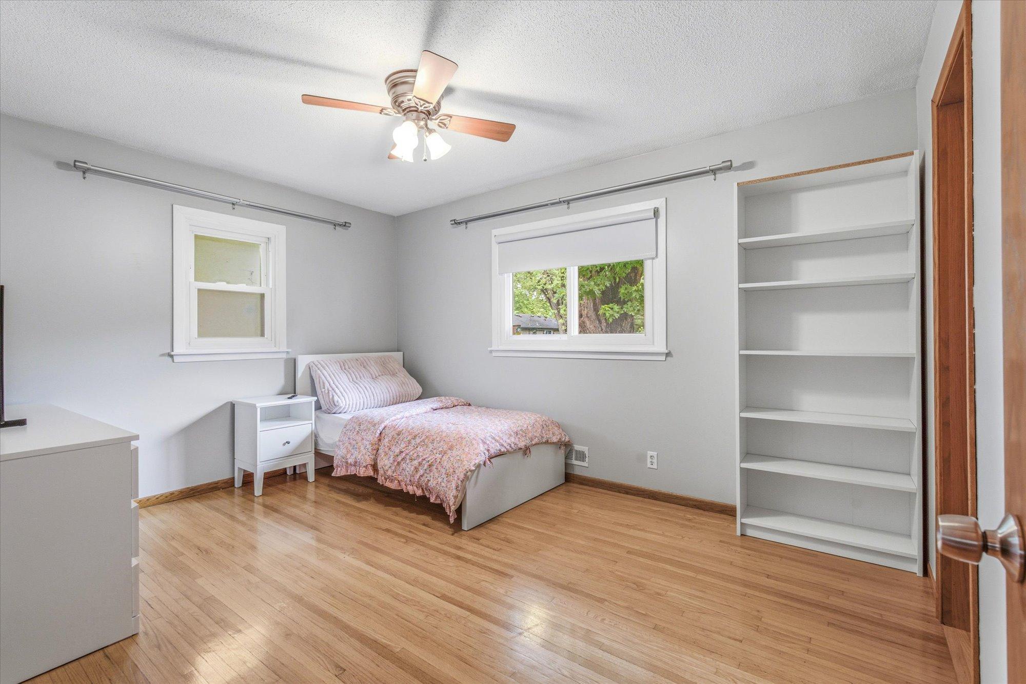 The spacious primary bedroom offers comfort, natural light, and generous closet space.
