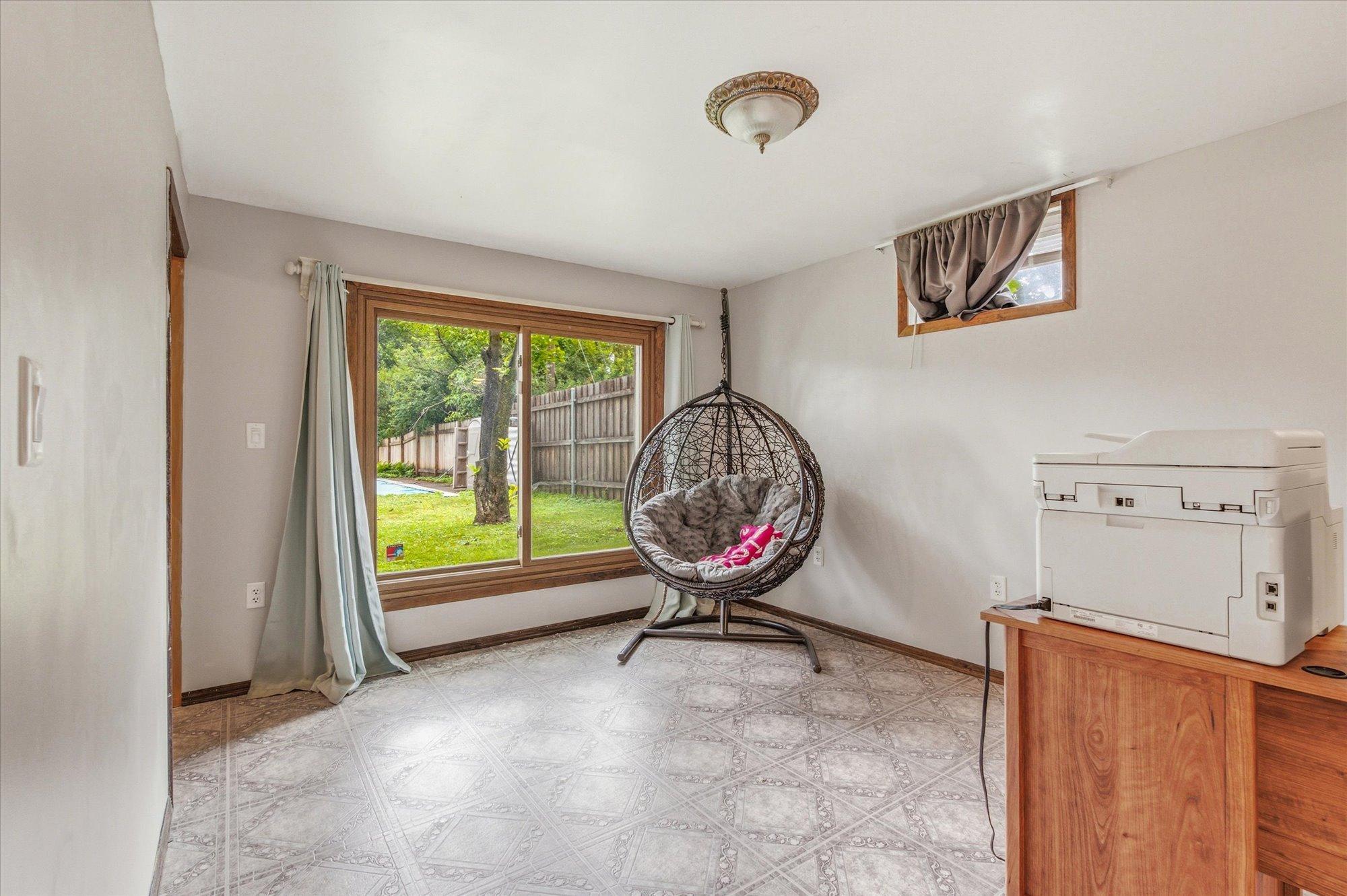 The lower-level recreation room is filled with natural light.