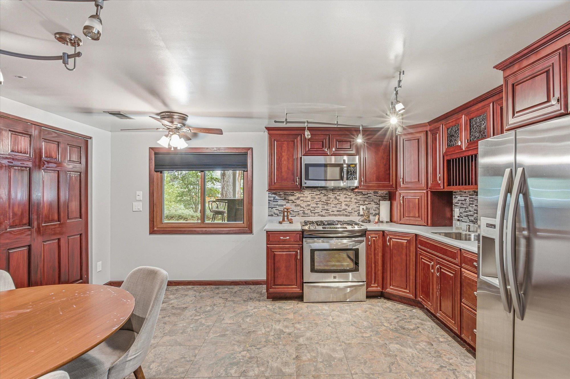 The lower-level kitchen and dining area create excellent entertaining possibilities.