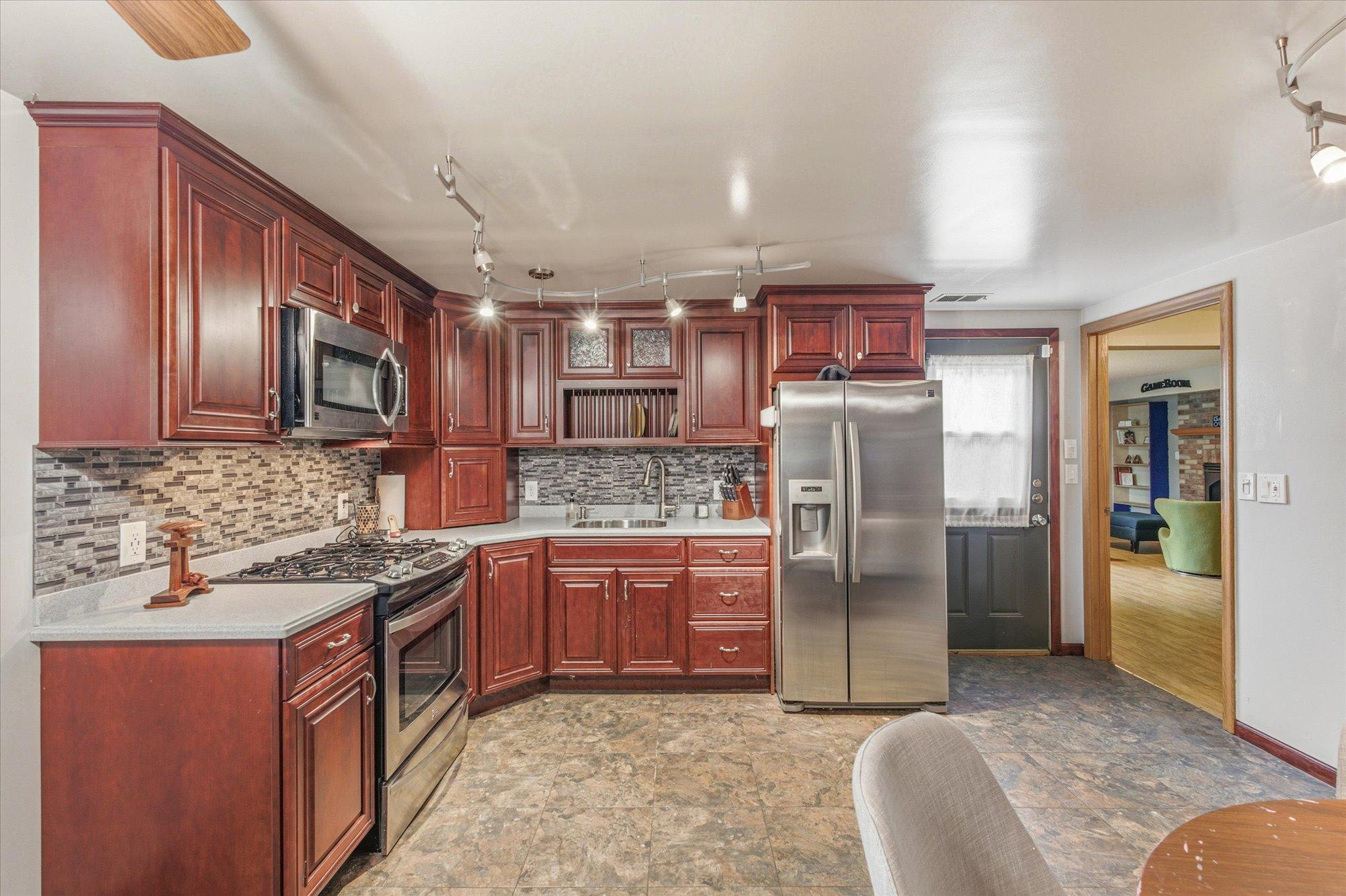 Rich cabinetry and abundant storage define this second full kitchen.