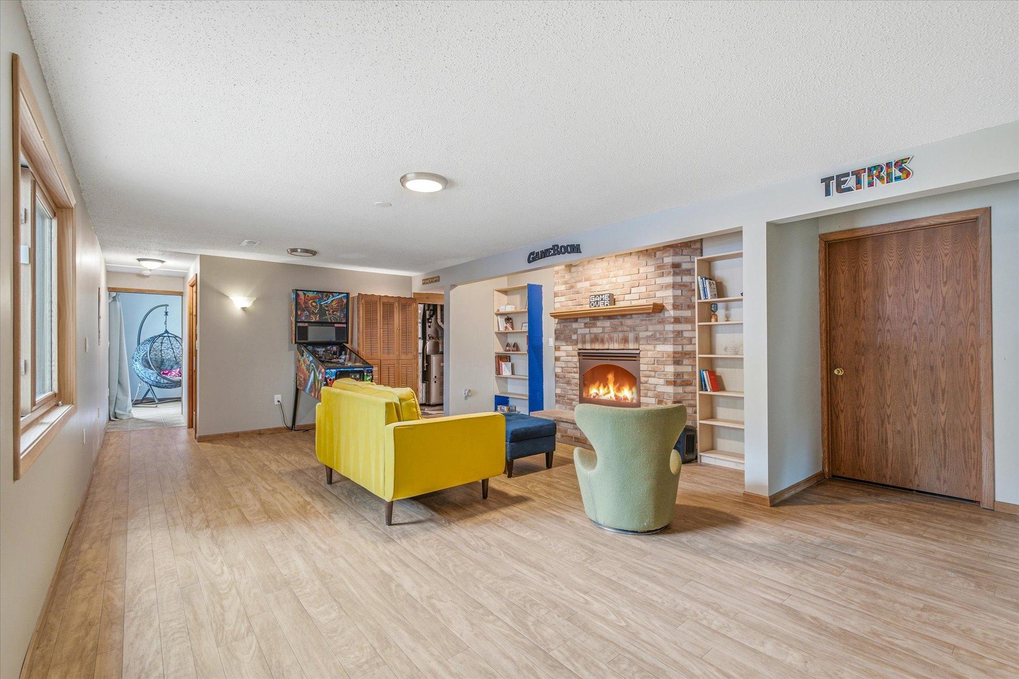 The finished lower-level family room offers incredible space for movie nights and entertaining.