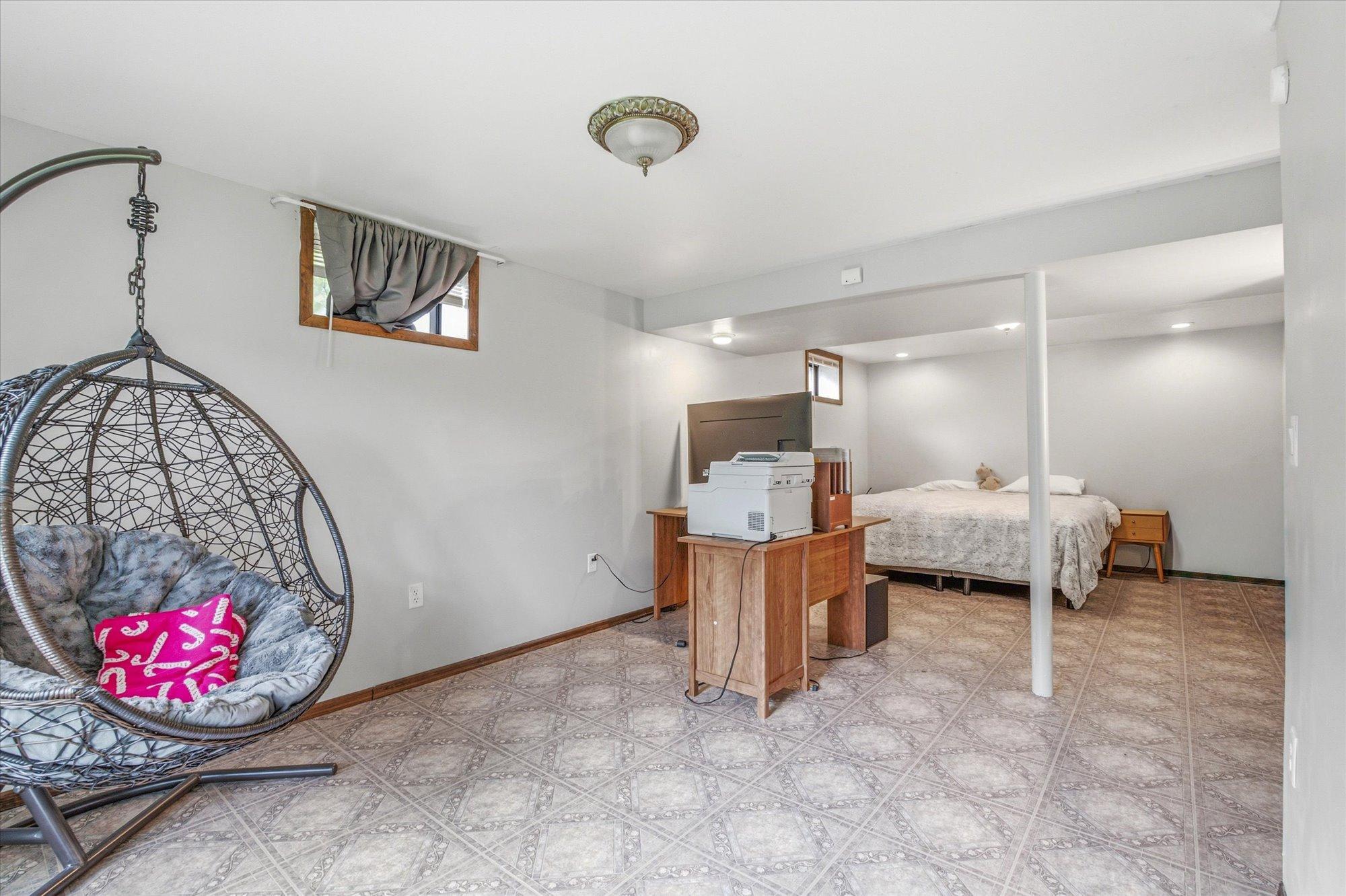 A spacious lower-level bedroom is perfect for guests or multi-generational living.