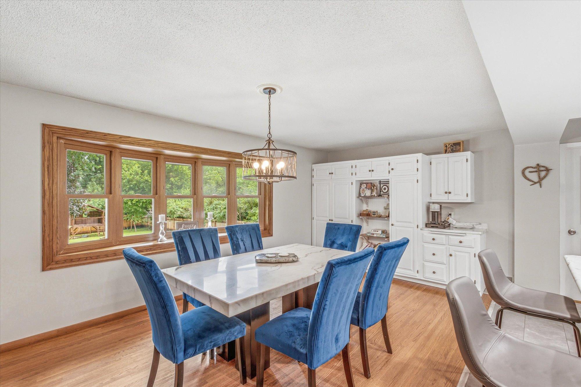 The dining area flows seamlessly into the surrounding living spaces.