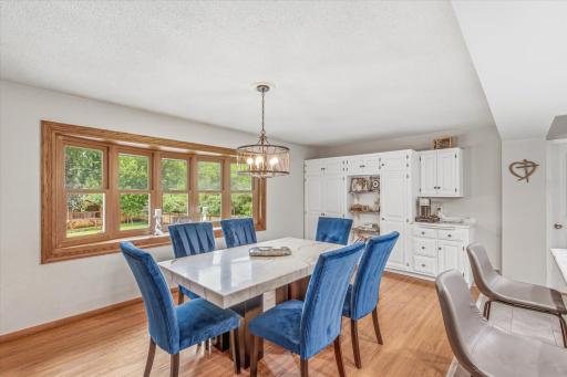 The dining area flows seamlessly into the surrounding living spaces.