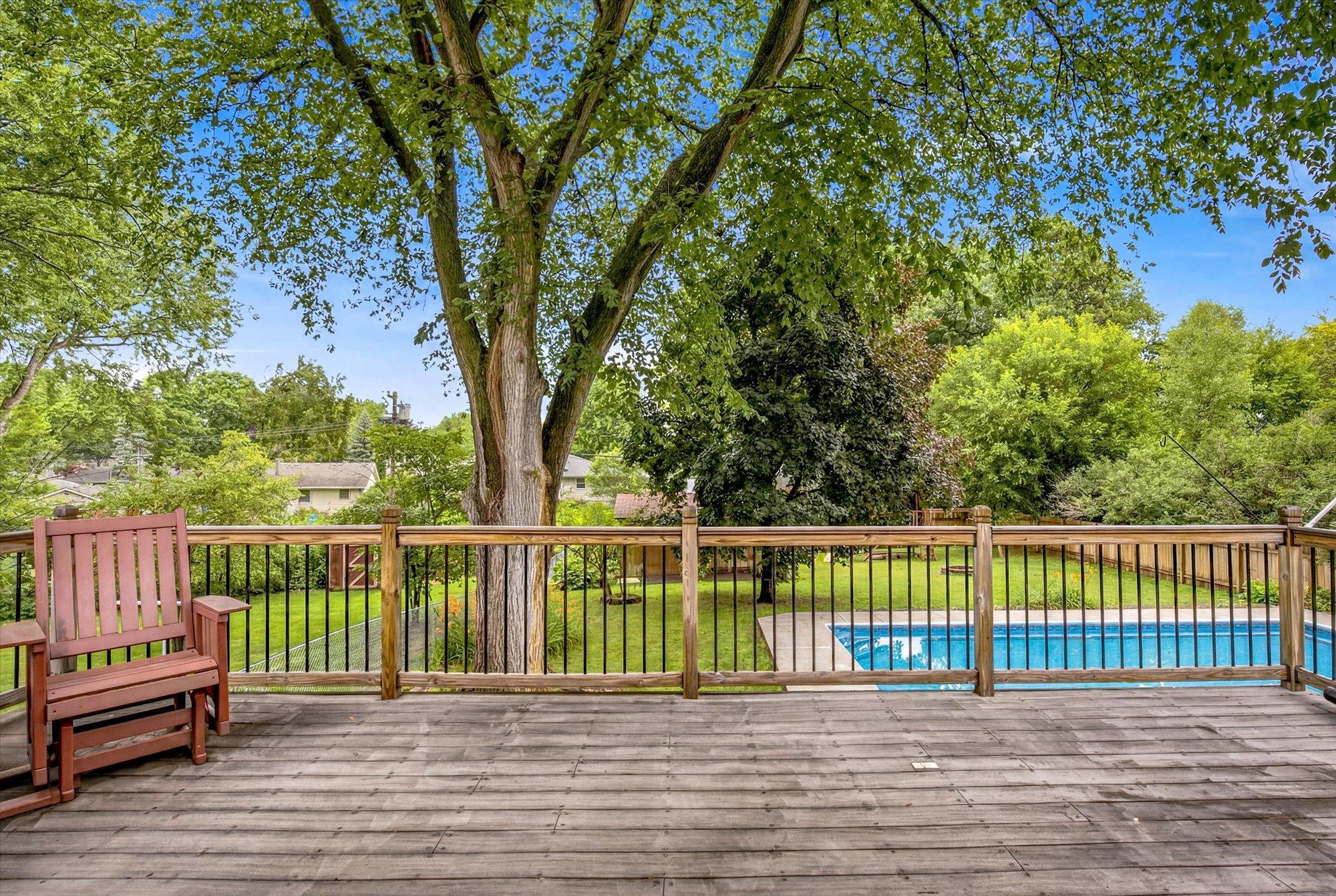 Step onto the spacious deck overlooking the backyard oasis.
