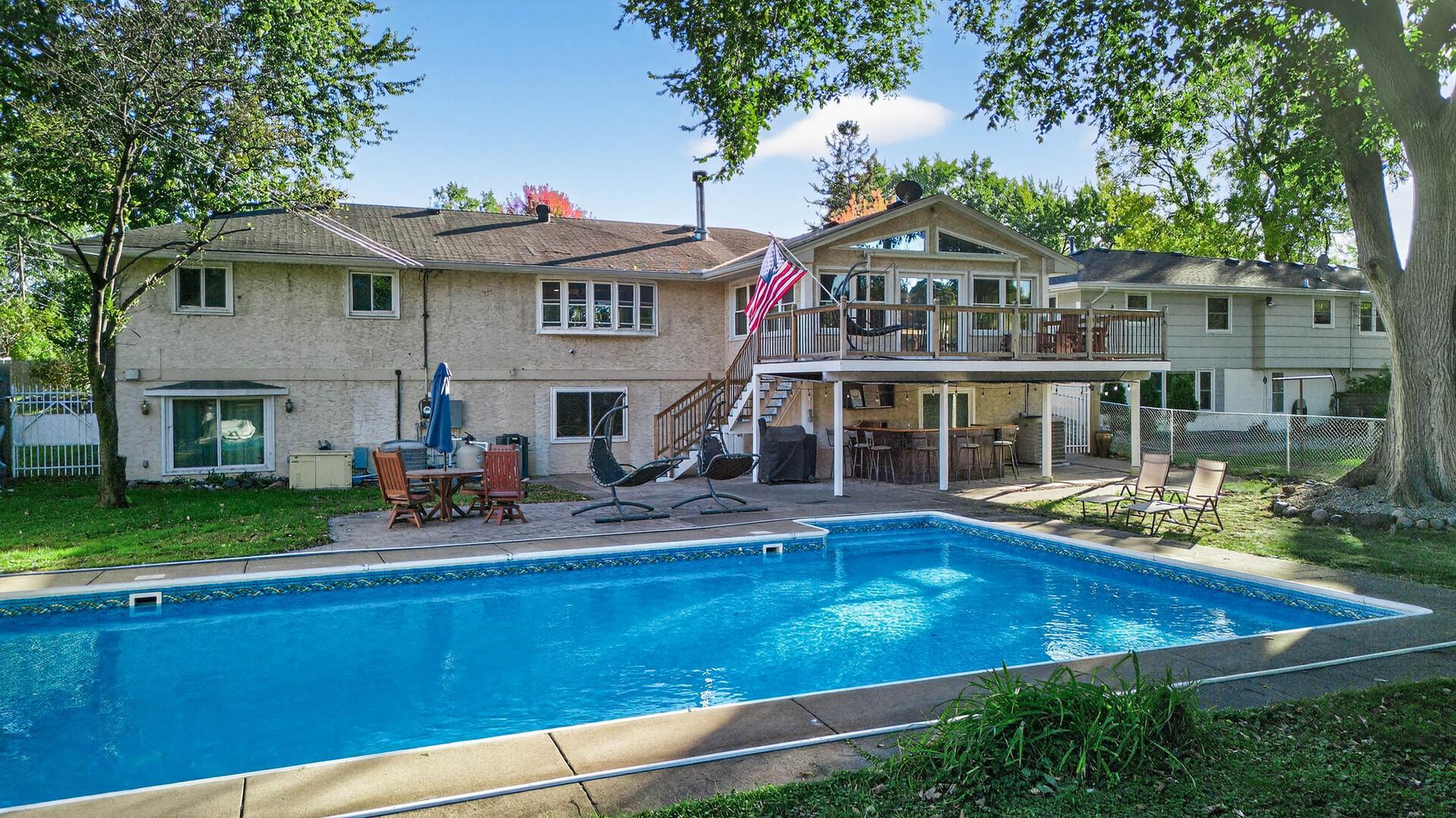 Resort-style living begins the moment you step outside to your own private backyard retreat featuring an incredible in-ground pool.