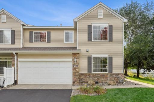 Corner unit with front door facing a pond.