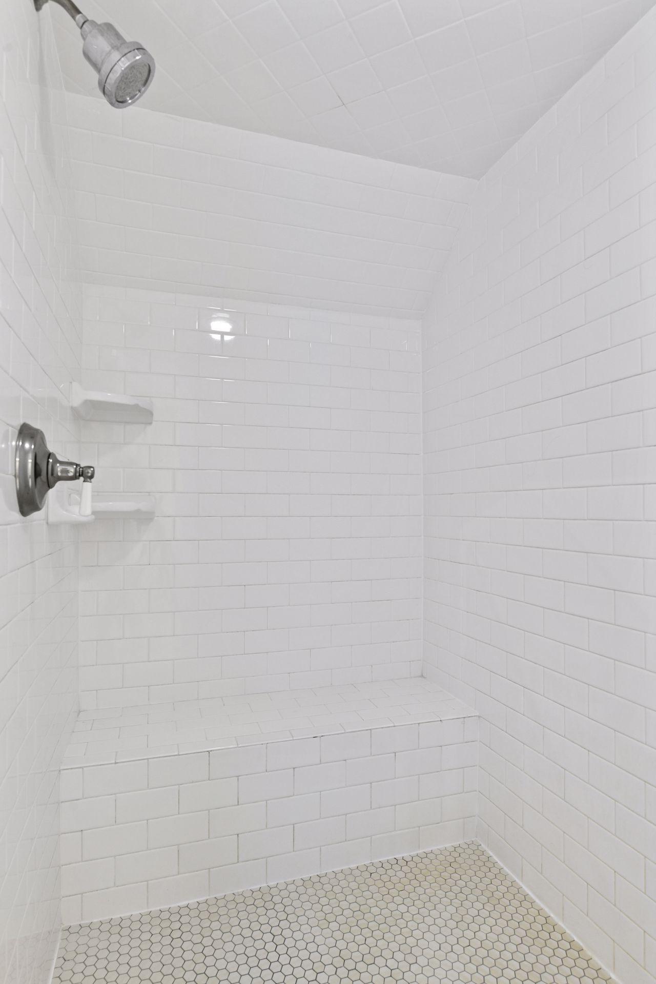 A separate, tiled shower completes the Primary Bathroom.