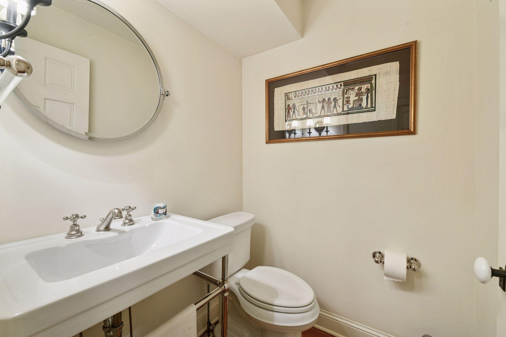 The main level Powder Room is located just off the Foyer.
