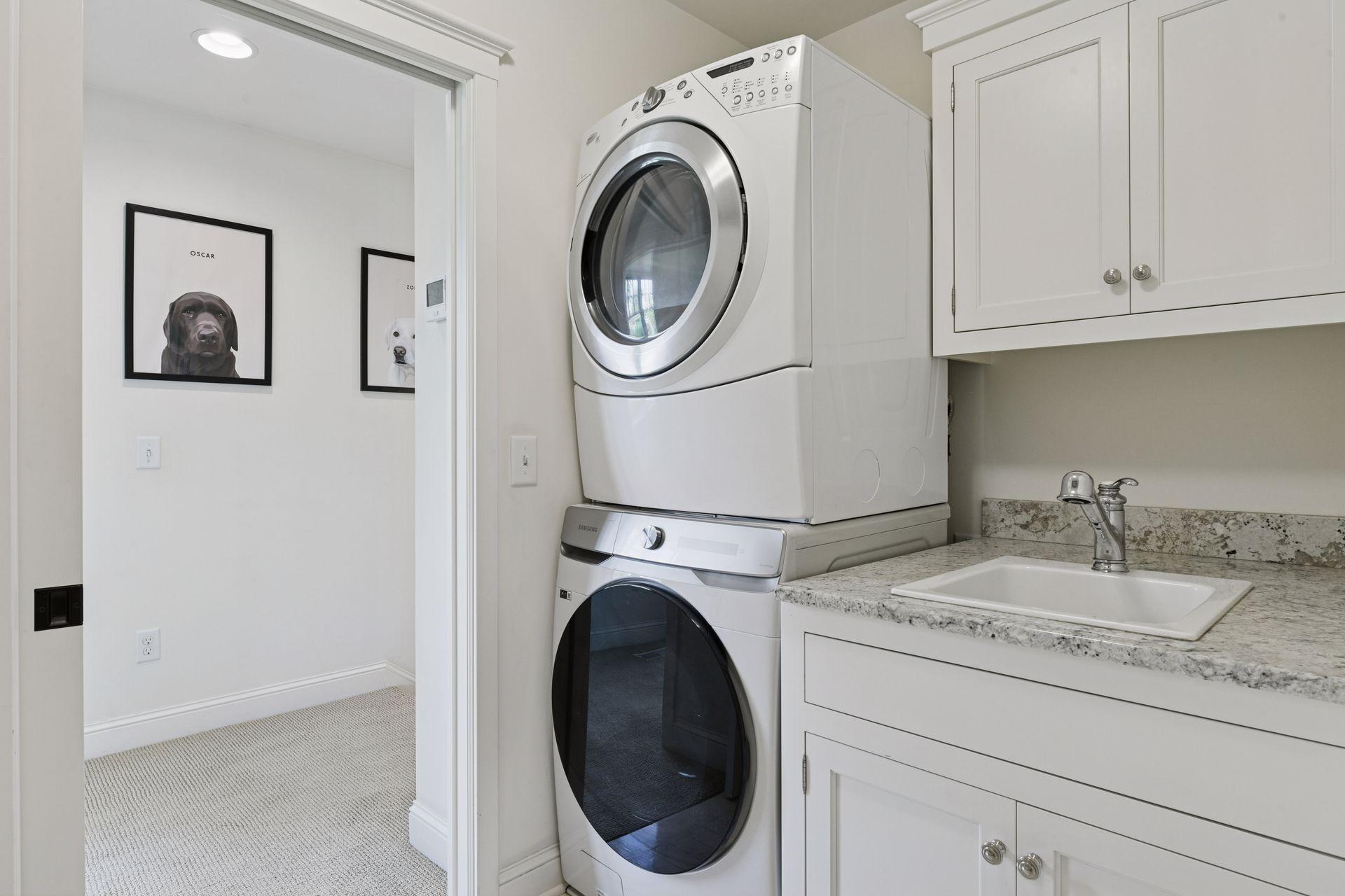Designed for everyday convenience, the upper level Laundry Room helps to keep your laundry organized - complete with a folding counter, built-in cabinetry and a laundry sink.