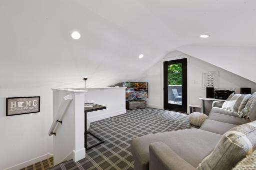 Designer carpeting leads you upstairs to the second living space - the City of Deephaven allows for plumbing to be added to the building for a future bathroom.
