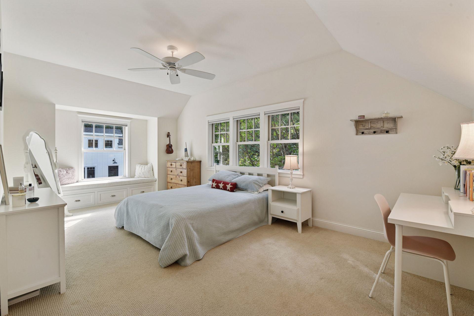 The second Junior Bedroom offers a built-in window bench and a walk-in closet with custom organizer.