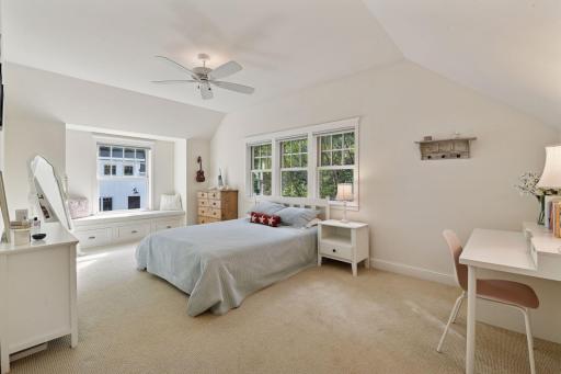 The second Junior Bedroom offers a built-in window bench and a walk-in closet with custom organizer.