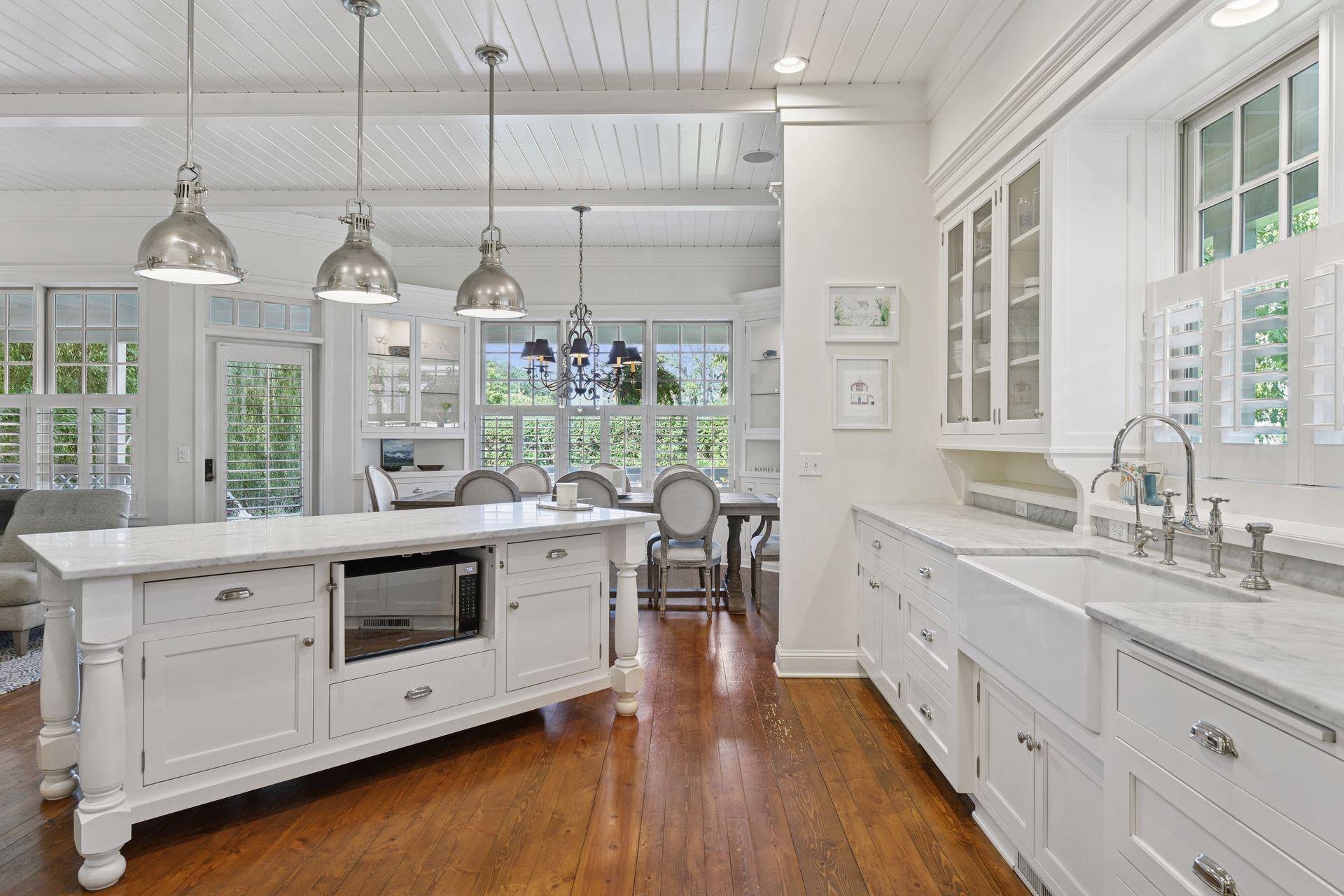 The furniture style island offers the perfect workspace for whipping up tasty meals or gathering with friends and family.