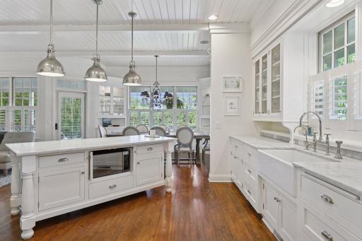 The furniture style island offers the perfect workspace for whipping up tasty meals or gathering with friends and family.
