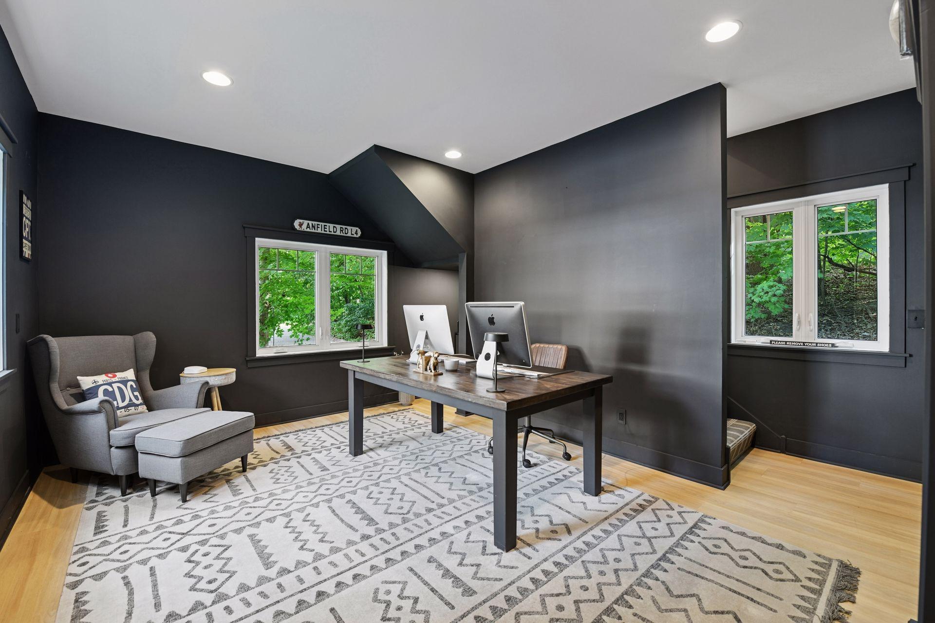 The main level of the Carriage House has been finished with LVP flooring and is a great space for a home office or family room.