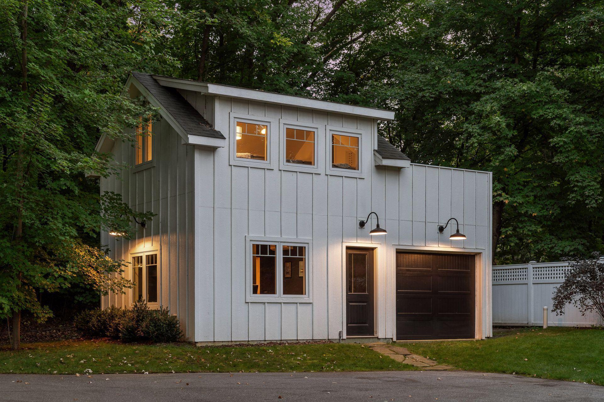 Newly constructed, the Carriage House is the perfect addition to this property with a third garage stall and welcoming spaces.