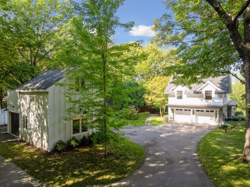 Situated on a half-acre lot surrounded by towering trees and cascading willows, this is a serene and private setting.