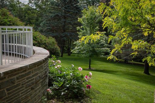 House backyard curved stair and peonies.jpg