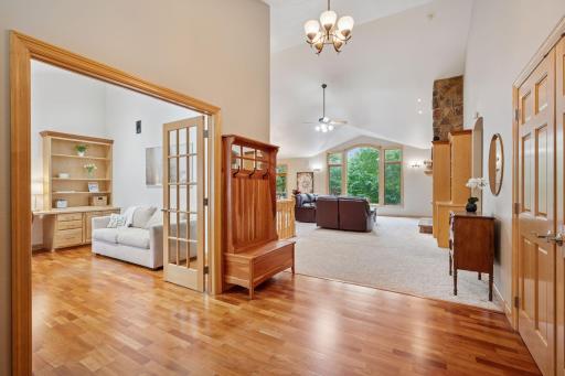 Dedicated home office with french doors and built in shelving.