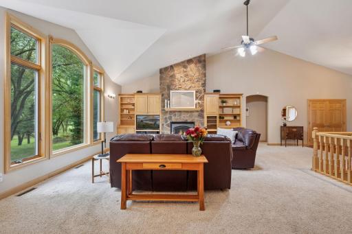 Sun-filled living room with expansive picture windows to take in the serene view.