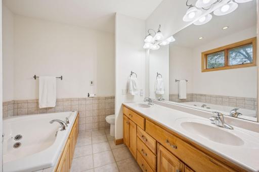 Primary en-suite bathroom features in floor heat throughout.