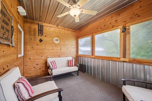 Just steps off the kitchen is a cozy cedar sided screen porch for relaxing evenings.