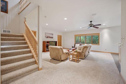 The walkout lower level boasts 9 foot ceilings, a large amusement room and plenty of sleeping spaces.