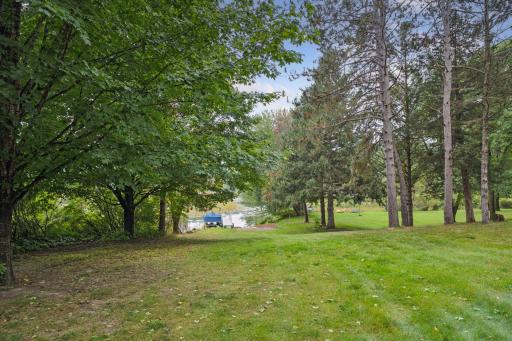 Level lakeshore is just steps away from the main house.