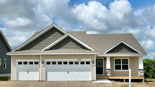2074 LaTour Drive! Charming front porch, ready for your personal touch. Driveway, sod, irrigation, landscape and trees included with home!