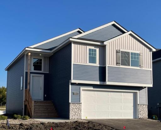 3214 Kady Ave NE- New Construction Home will be ready for move-in 10/21/2025! Highlights include a finished walkout lower level located on a Cul-De-Sac Homesite! Front door will be painted and sod installed soon.