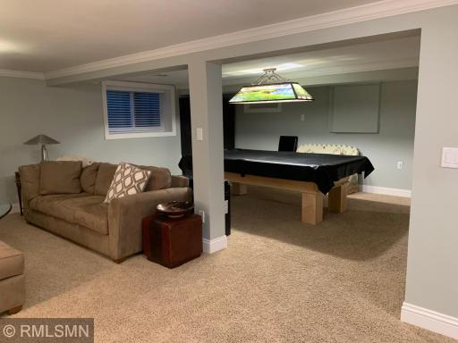 Lower level with double egress window with wood finish. Potentially could be turned into another bedroom.