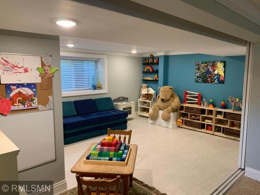 Lower level bedroom 4 with a nano-style wall allowing flexibility with the space and double egress window