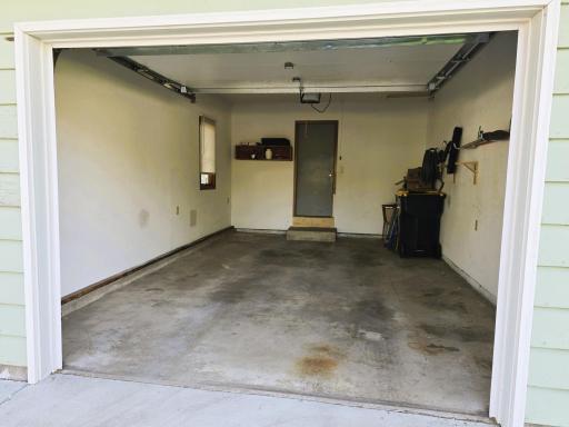 Single car garage, insulated, with garage door opener.