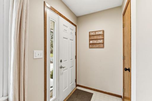 Welcoming front entry with clean lines, updated door, and a simple, functional approach that sets the tone for the homeâs interior.