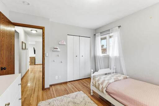 Well-sized bedroom with natural light, offering flexibility for sleeping, workspace, or a combination of both.