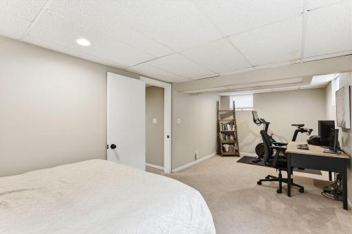 Lower level bedroom with additional space for a home office, workout area, or flexible use depending on your needs.