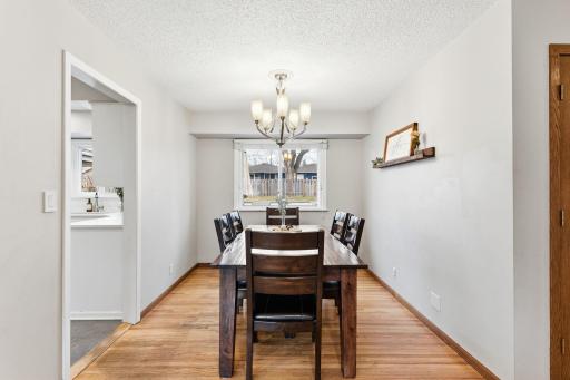 Dedicated dining area with updated lighting and space to comfortably host gatherings, positioned just off the kitchen for everyday convenience.