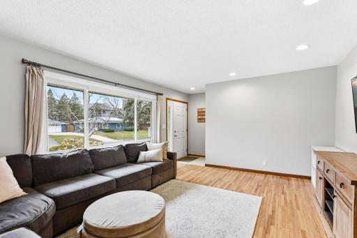 Spacious living room anchored by a large picture window, bringing in natural light and offering a bright, comfortable setting for everyday living.
