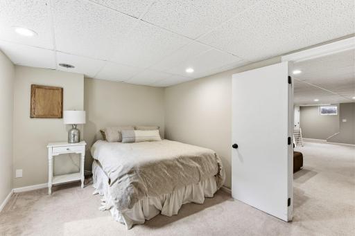 Additional lower-level bedroom offering privacy and flexibility for guests, office use, or extended living space.