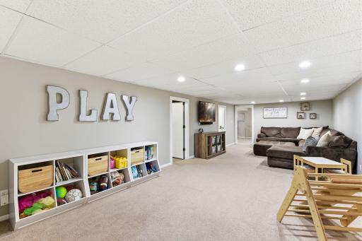 Spacious lower level offering a flexible layout for a second living area, media space, or playroom.