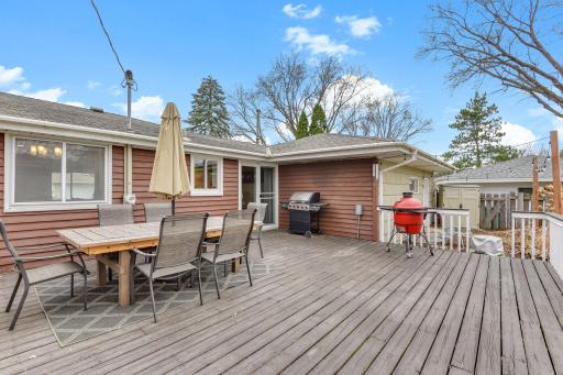 Spacious deck ideal for outdoor dining, grilling, and entertaining with easy access to the backyard.