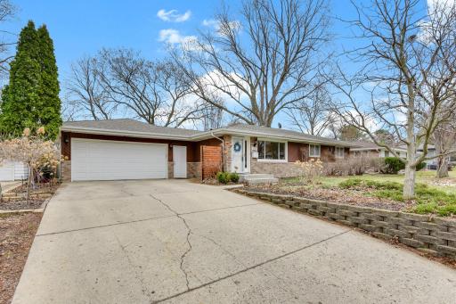 An extended driveway leads to an attached 2.5 stall garage, offering ample parking and everyday convenience with easy access to the home.