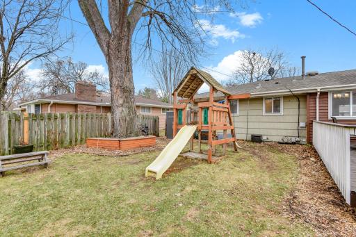 Backyard play area with space for recreation, gatherings, or future customization.