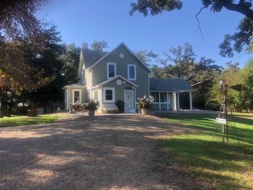 This 1900's farmhouse was completely rebuilt from the studs with hand-crafted details and modern finishes, including hickory floors, knotty pine stairs, barn doors, and galvanized accents.