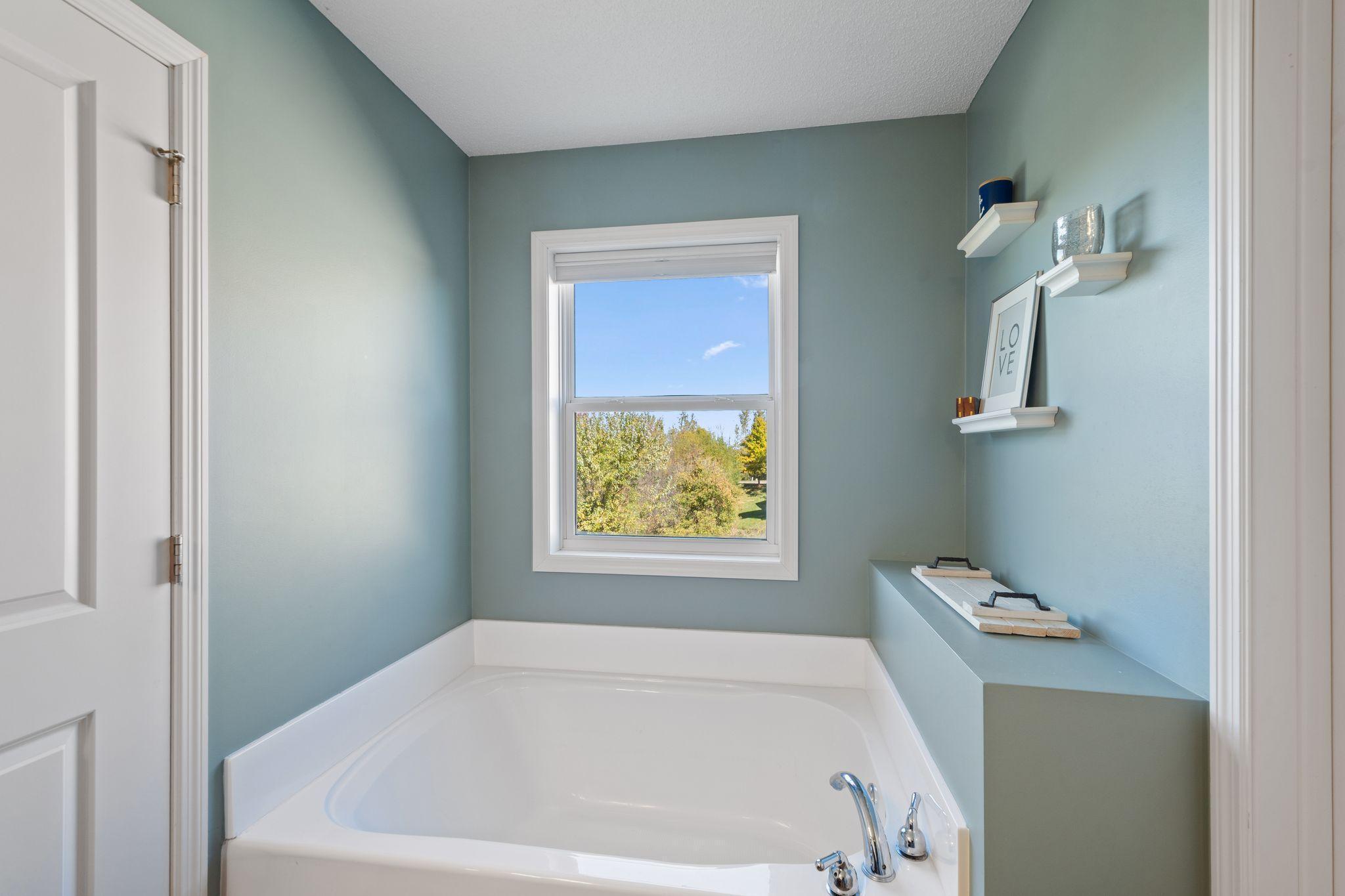 And a large soaking tub with plenty of natural light.