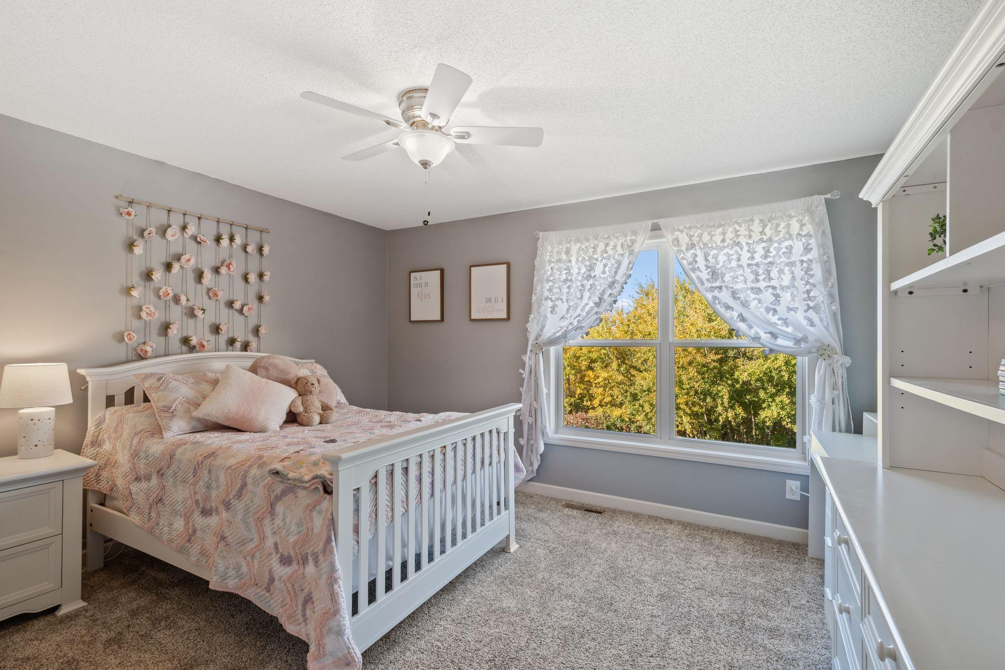 Each bedroom boasts large windows and bright, natural light.
